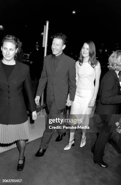 Lyle Lovett and April Kimble attend the local premiere of "Cookie's Fortune" at Cineplex Odeon Showcase Cinemas in Los Angeles, California, on March...