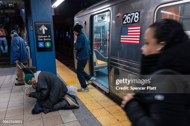 Man panhandles on a New York City subway platform on March 06, 2024 in New York City. Following a surge in crime on the subways, New York Governor...