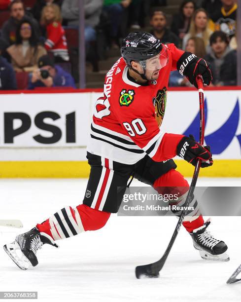 Tyler Johnson of the Chicago Blackhawks takes a shot on goal against the Pittsburgh Penguins during the second period at the United Center on...