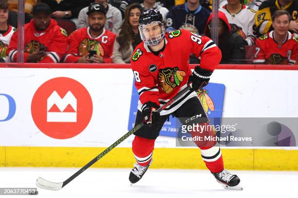 Connor Bedard of the Chicago Blackhawks controls the puck against the Pittsburgh Penguins during the second period at the United Center on February...