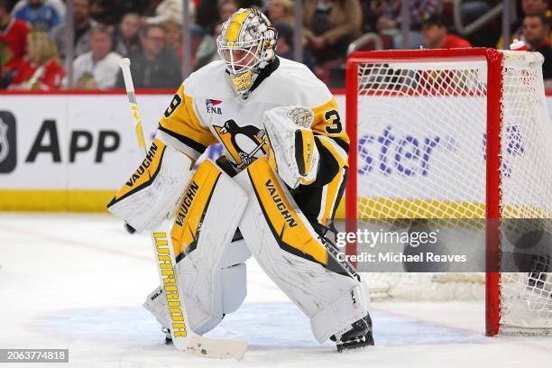 Alex Nedeljkovic of the Pittsburgh Penguins tends the net against the Chicago Blackhawks during the second period at the United Center on February...
