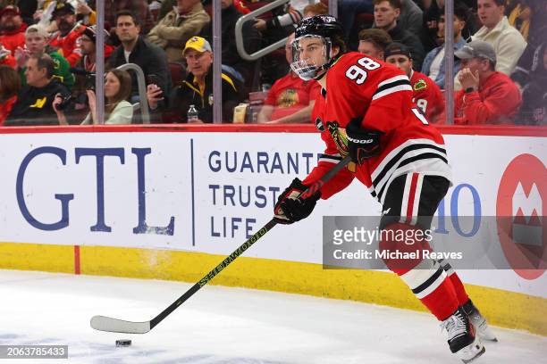 Connor Bedard of the Chicago Blackhawks controls the puck against the Pittsburgh Penguins during the first period at the United Center on February...