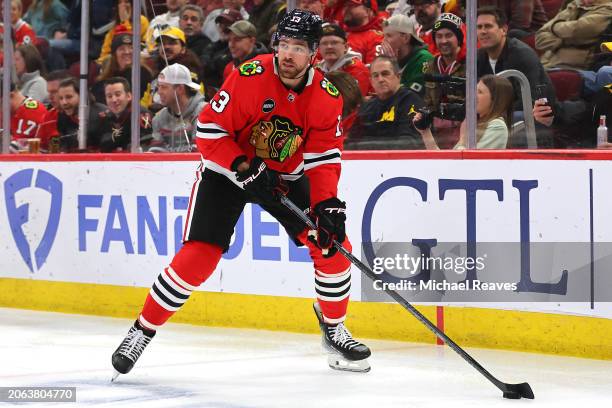 Zach Sanford of the Chicago Blackhawks skates with the puck against the Pittsburgh Penguins during the first period at the United Center on February...