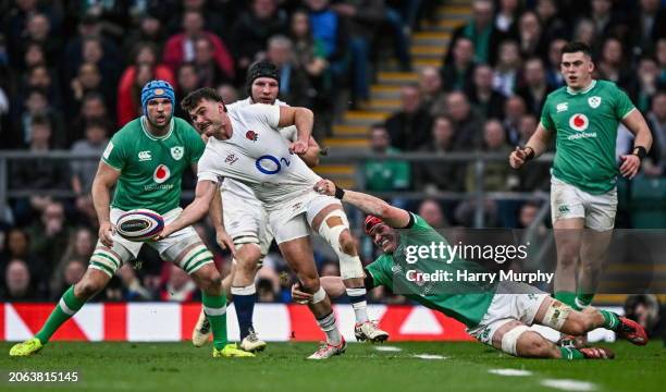 London , United Kingdom - 9 March 2024; George Furbank of England is tackled by Josh van der Flier of Ireland during the Guinness Six Nations Rugby...