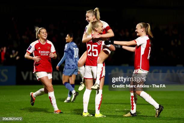 Stina Blackstenius of Arsenal celebrates with Alessia Russo, Leah Williamson and Frida Maanum of Arsenal after scoring her team's fourth goal to...