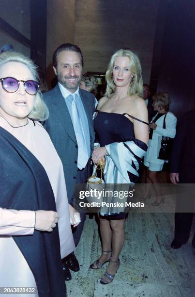 Guest, Ron Silver, and Catherine De Castelbajac attend a 40th-anniversary party at the Four Seasons, a restaurant in New York City, on June 25, 1999.