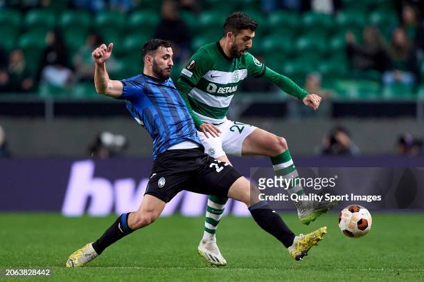 Sead Kolasinac of Atalanta competes for the ball with Paulinho of Sporting CP during the UEFA Europa League 2023/24 round of 16 first leg match...