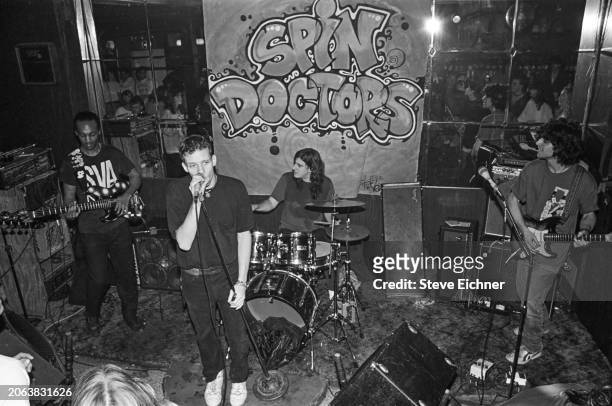 Members of Rock group Spin Doctors perform onstage at the Nightingale bar, New York, New York, April 1, 1990. Pictured are, from left, Mark White, on...