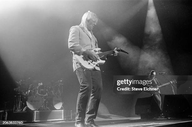 Canadian Rock musician Alex Lifeson, of the group Rush, plays electric guitar as he performs onstage at Nassau Coliseum , Uniondale, New York, April...