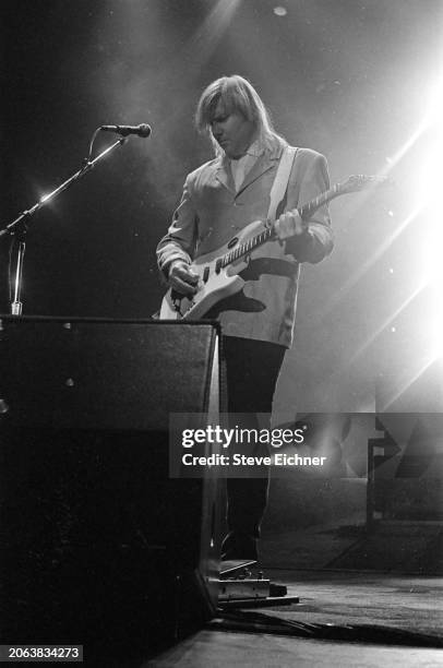 Canadian Rock musician Alex Lifeson, of the group Rush, plays electric guitar as he performs onstage at Nassau Coliseum , Uniondale, New York, April...