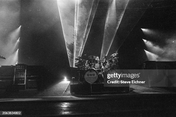 Canadian Rock musician Neil Peart , of the group Rush, plays drums as he performs onstage at Nassau Coliseum , Uniondale, New York, April 22, 1990.