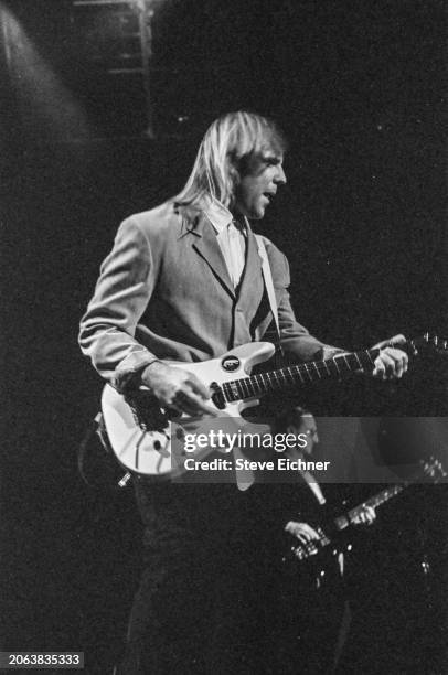 Canadian Rock musician Alex Lifeson, of the group Rush, plays electric guitar as he performs onstage at Nassau Coliseum , Uniondale, New York, April...