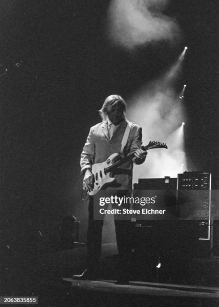 Canadian Rock musician Alex Lifeson, of the group Rush, plays electric guitar as he performs onstage at Nassau Coliseum , Uniondale, New York, April...