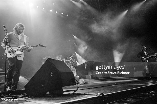 Canadian Rock musician Alex Lifeson, of the group Rush, plays electric guitar as he performs onstage at Nassau Coliseum , Uniondale, New York, April...