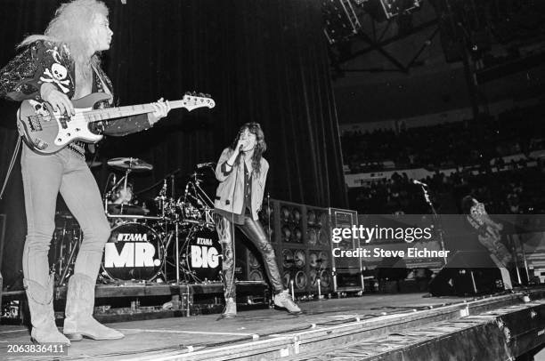 Members of the Rock group Mr Big perform onstage at Nassau Coliseum , Uniondale, New York, April 22, 1990. Pictured are, from left, Billy Sheehan, on...