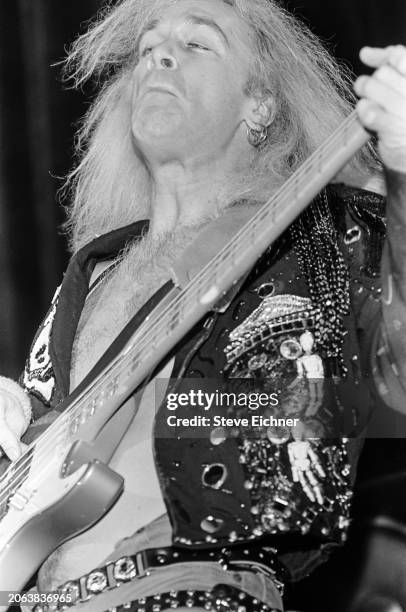 American Rock musician Billy Sheehan, of the group Mr Big, plays bass guitar as he performs onstage at Nassau Coliseum , Uniondale, New York, April...