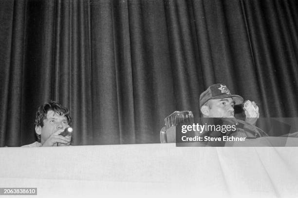 View of American magazine publisher & Rolling Stone co-founder Jann Wenner and journalist & author Hunter S Thompson onstage during an appearance at...