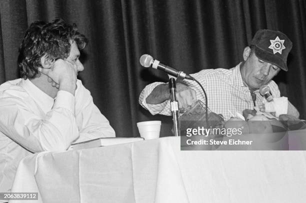 View of American magazine publisher & Rolling Stone co-founder Jann Wenner and journalist & author Hunter S Thompson onstage during an appearance at...