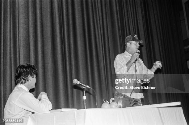 As American magazine publisher & Rolling Stone co-founder Jann Wenner watches, journalist & author Hunter S Thompson speaks onstage during an...