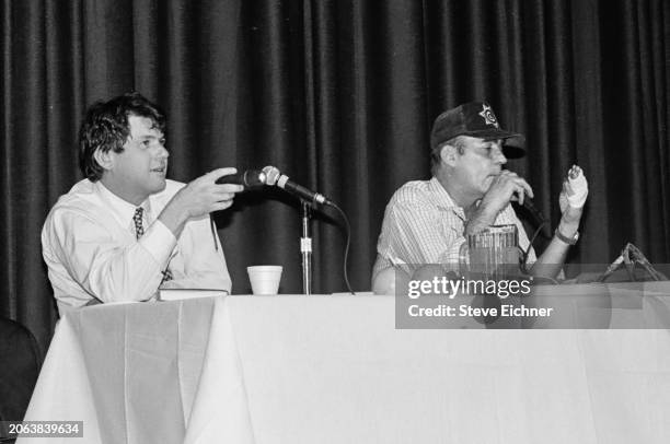 View of American magazine publisher & Rolling Stone co-founder Jann Wenner and journalist & author Hunter S Thompson onstage during an appearance at...