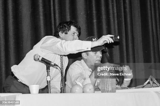 View of American magazine publisher & Rolling Stone co-founder Jann Wenner and journalist & author Hunter S Thompson onstage during an appearance at...