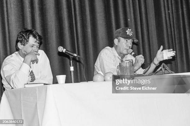 View of American magazine publisher & Rolling Stone co-founder Jann Wenner and journalist & author Hunter S Thompson onstage during an appearance at...