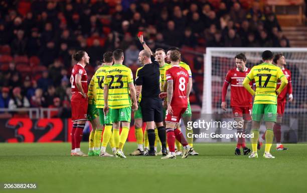 Referee, Robert Madley shows a red card to Borja Sainz of Norwich City during the Sky Bet Championship match between Middlesbrough and Norwich City...