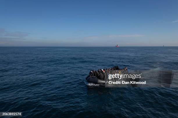 An inflatable dinghy carrying around 65 migrants crosses the English Channel on March 06, 2024 in the English Channel. According to official figures...