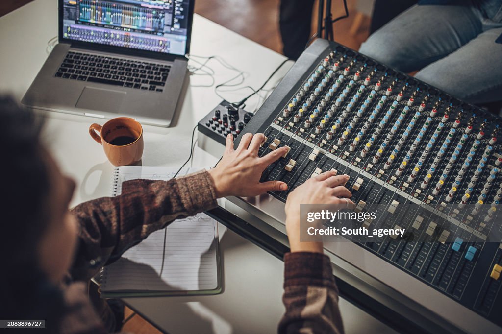 Music producer working in music studio