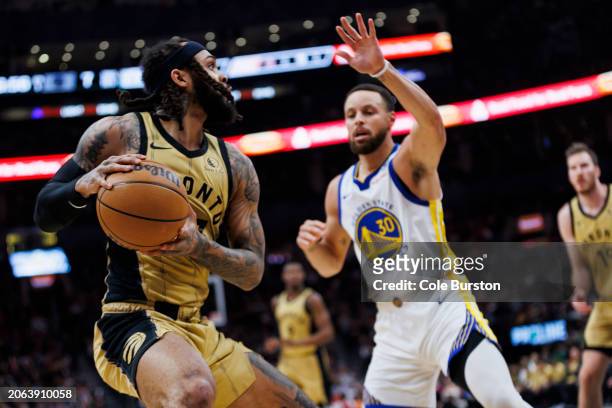 Gary Trent Jr. #33 of the Toronto Raptors looks to make a pass against the Golden State Warriors during the first half of their NBA game at...