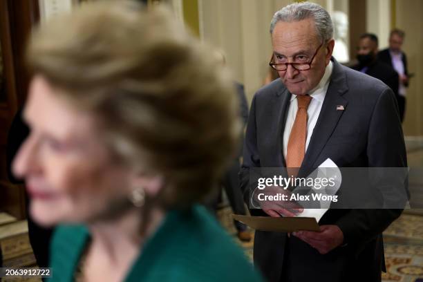 Senate Majority Leader Sen. Chuck Schumer listens during a news briefing after a weekly Senate Democrat policy luncheon at the U.S. Capitol on March...
