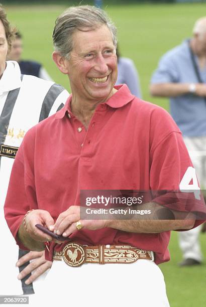 His royal highess Prince Charles, The Prince of Wales shares a joke after a hard match at the Chakravarty polo cup match on June 7, 2003 in Tetbury,...