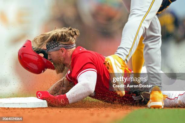 Andruw Monasterio of the Milwaukee Brewers tags out Jake Fraley of the Cincinnati Reds as he attempts to steal second base in the second inning...