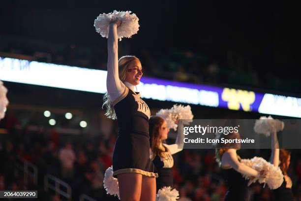 Notre Dame Fighting Irish cheerleader is held in the air during player introductions during the college basketball game between the Notre Dame...