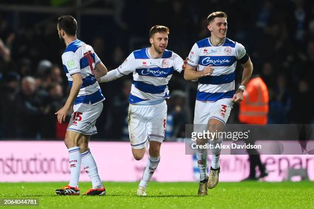 Sam Field of Queens Park Rangers celebrates scoring his team's second goal with teammates Morgan Fox and Jimmy Dunne during the Sky Bet Championship...