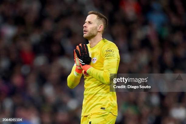 Peter Gulacsi of Leipzig reacts during the UEFA Champions League 2023/24 round of 16 second leg match between Real Madrid CF and RB Leipzig at...