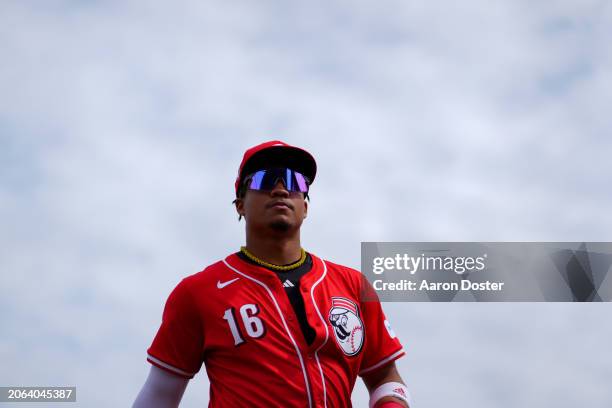 Noelvi Marte of the Cincinnati Reds walks to the dugout between innings during a spring training game against the Milwaukee Brewers at Goodyear...