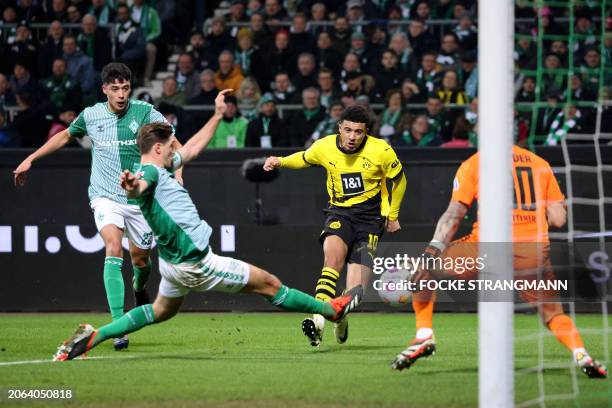 Dortmund's English midfielder Jadon Sancho shoots and scores the 2-0 goal during the German first division Bundesliga football match Werder Bremen v...