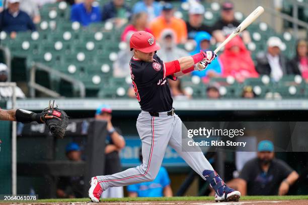 Lane Thomas of the Washington Nationals at bat during a spring training game against the Miami Marlins at Roger Dean Stadium on March 06, 2024 in...