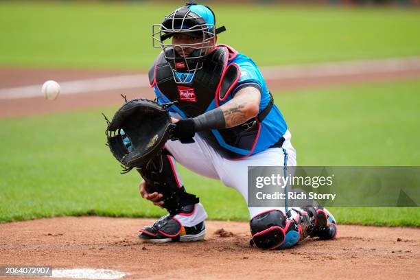 Christian Bethancourt of the Miami Marlins warms up prior to a spring training game against the Washington Nationals at Roger Dean Stadium on March...