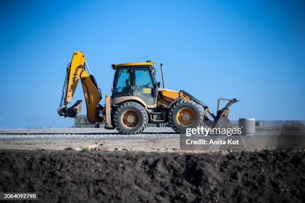 yellow bulldozer at construction site - pomorskie province stock pictures, royalty-free photos & images