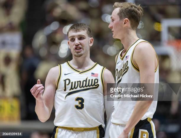 Braden Smith talks with Fletcher Loyer of the Purdue Boilermakers during the game against the Michigan State Spartans at Mackey Arena on March 2,...