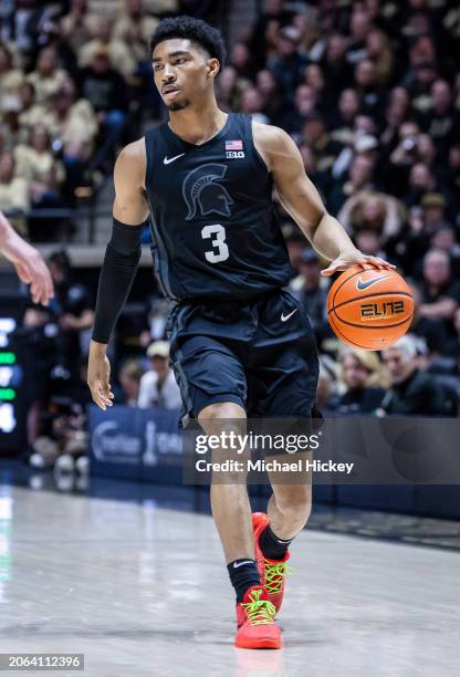 Jaden Akins of the Michigan State Spartans brings the ball up court during the game against the Purdue Boilermakers at Mackey Arena on March 2, 2024...