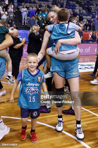 Lauren Jackson of the Flyers celebrates with her children after winning game three of the WNBL Semi Final series between Southside Flyers and...