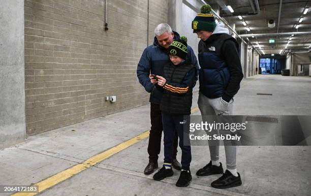 Cork , Ireland - 9 March 2024; Tipperary supporters, from left, Johnny Ryan, his sons James Ryan, age 10, and Sean Gribbin, age 14, from Boherlahan...