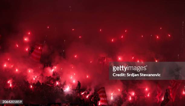 Supporters of Crvena Zvezda light flares during the Super liga match between FK Crvena Zvezda and FK Partizan at Stadium Rajko Mitic on March 09,...