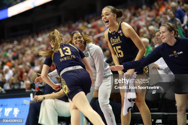 The bench celebrates the three point basket by Notre Dame Fighting Irish guard Anna DeWolfe during the college basketball game between the Notre Dame...