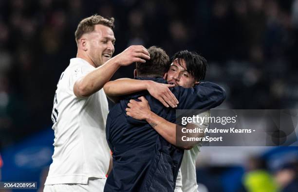 Marcus Smith of England celebrates victory at the end of the match with team mates George Ford and Alex Dombrandt during the Guinness Six Nations...