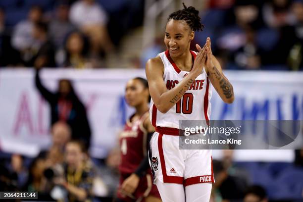 Aziaha James of the NC State Wolfpack reacts against the Florida State Seminoles during the first half of the game in the Semifinals of the ACC...