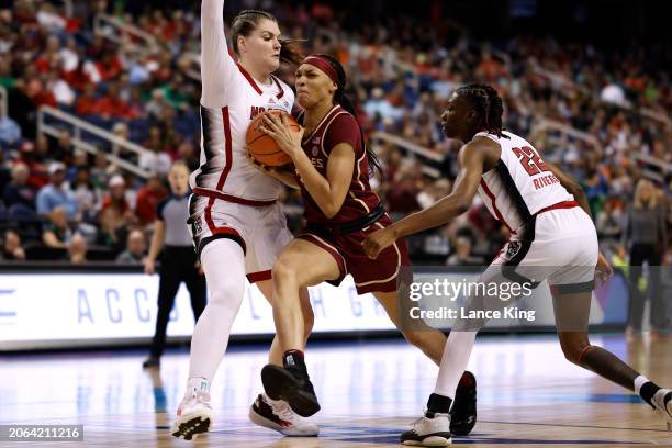 Makayla Timpson of the Florida State Seminoles drives against River Baldwin of the NC State Wolfpack during the first half of the game in the...